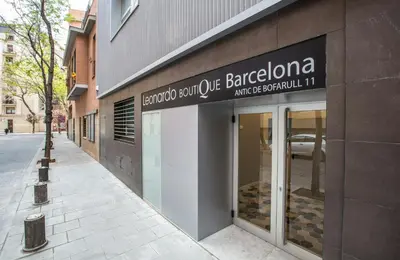 a store with a sign on the side of a building at Leonardo Boutique Hotel Barcelona Sagrada Familia in Barcelona