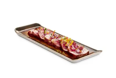 a tray of food with meat and vegetables on it at Grums Hotel & Spa in Barcelona
