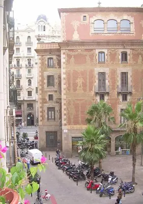 a group of motorcycles parked in front of a building at Hostal del Palau in Barcelona