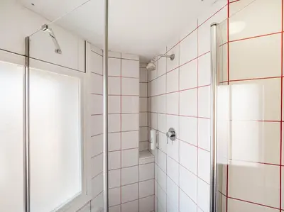 a bathroom with a shower and a window at Hostal Athenas in Sant Adria de Besos