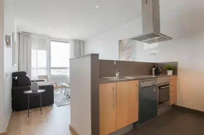 a kitchen with a sink and a stove top oven at Tendency Apartments 3 in Barcelona