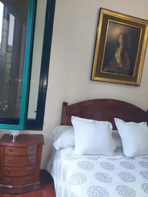 a bedroom with a bed and a painting on the wall at Apartamento Gran Via de les Corts Catalanes in Barcelona