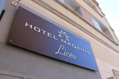 a sign on the side of a building at Hotel Madanis Liceo in Hospitalet de Llobregat