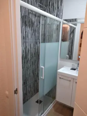 a bathroom with a shower and a sink at Hostal Restaurante Cornella in Cornellà de Llobregat