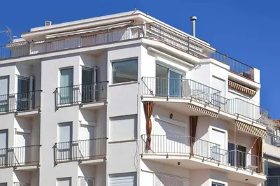 an apartment building with balconies on the side of it at Sitges Bellavista · Vistas Espectaculares del Mar in Sitges