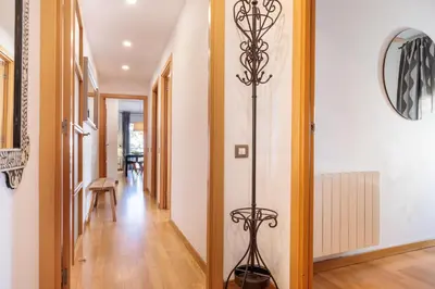 a hallway with a floor lamp in a house at Mar Bella Beach Apartments in Barcelona