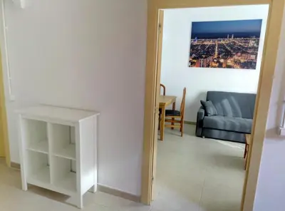 a living room with a couch and a table at Casa Carmen Barcelona in El Prat de Llobregat