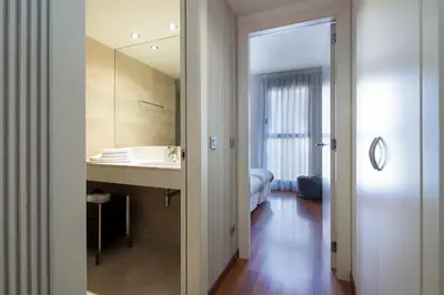 a bathroom with a sink and a mirror at Inside Barcelona Apartments Mercat in Barcelona