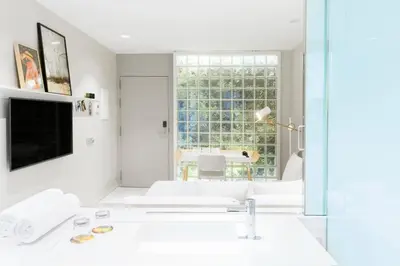 a white room with a sink and a window at Hotel Rec Barcelona - Adults Only in Barcelona