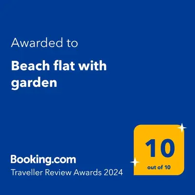 a yellow sign with a beach flat with garden at Beach flat with garden in Castelldefels