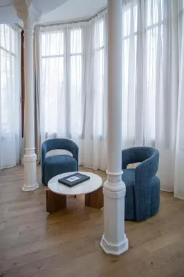 a living room with two chairs and a table at Storni Barcelona by Forget me not in Barcelona