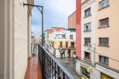 a view of a city street from a balcony at Fira Barcelona Apartment in Hospitalet de Llobregat