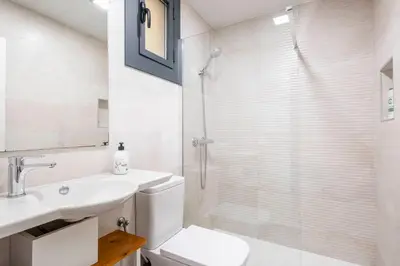 a bathroom with a toilet and a sink and a shower at Fira Barcelona Apartment in Hospitalet de Llobregat