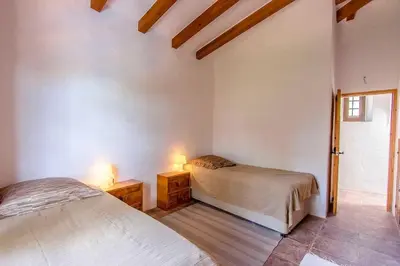 a bedroom with two beds and two lamps in it at Catalunya Casas Majestic Villa and Views , 30km to Barcelona in Corbera de Llobregat