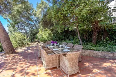 a table and chairs on a brick patio at Catalunya Casas Majestic Villa and Views , 30km to Barcelona in Corbera de Llobregat