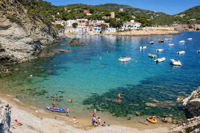 a group of people on a beach in the water at Catalunya Casas Modern Magnificence , only a few km to the beach! in Sant Cebrià de Vallalta