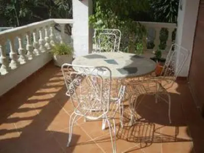 a patio table and chairs on a balcony at Mar De Cunit in Cunit