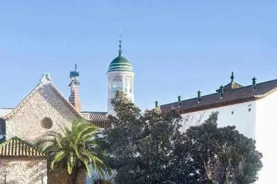 a building with a clock tower on top of it at Sitges Malvasia · Paz en el Corazón de Sitges in Sitges