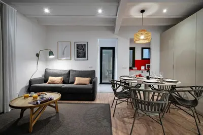 a living room with a couch and a table at Verdi Habitat Apartments in Barcelona