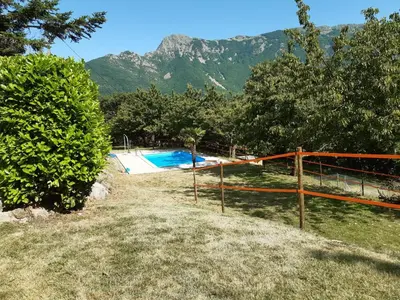 a view of a swimming pool with mountains in the background at Sant Marçal del Montseny in Montseny
