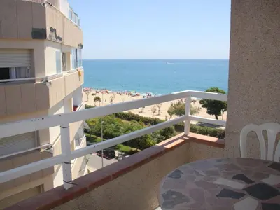 a balcony of a building with a view of the beach at VicAm Atico Duplex in Pineda de Mar