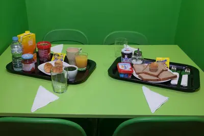a table with two trays of food and drinks at Mellow Barcelona in Barcelona