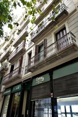 a building with balconies on the side of it at Apartaments Sant Jordi Girona 97 in Barcelona