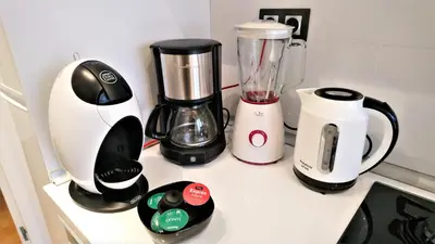a counter with a blender and other appliances on it at Cristina Port & Beach - Apartment in Masnou