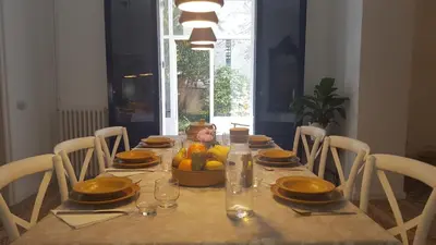 a dining table with a bowl of fruit on it at Can Calixto in Aiguafreda