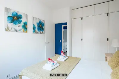 a bedroom with two pairs of shoes on a bed at Alcam Rogent in Barcelona