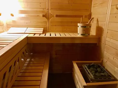 a sauna with two beds and a bucket in it at Villa Rosa Sitges in Can Trabal