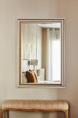 a mirror hanging on a wall in a room at Alcam Plaza Cataluña in Barcelona