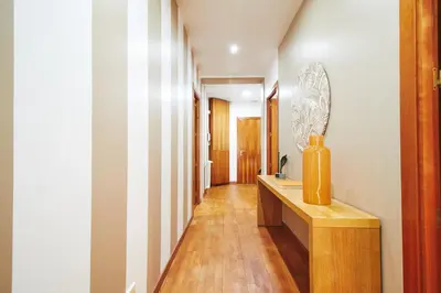 a hallway with a sink and a mirror at Alcam Plaza Cataluña in Barcelona