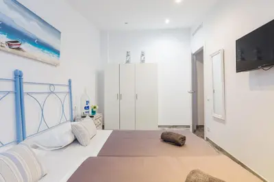a bedroom with a bed and a flat screen tv at Vilasarmarlux II in Vilassar de Mar