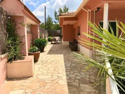 a courtyard of a house with potted plants at Casa Mallarenga Rooms in Olivella