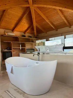 a large white bath tub in a room at Boutique hotel Urbisol in Calders