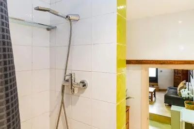 a bathroom with a sink and a mirror at Fridays Flats Dreamy Duplex - Stylish Beach Loft in Barcelona