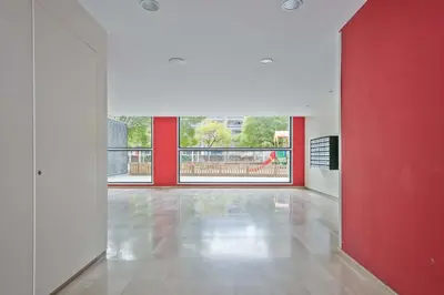 an empty room with red and white walls and a red wall at 1213 - Ciutadella Nice Apartment in Barcelona