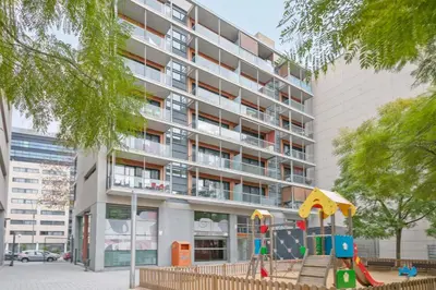 a playground in front of a building at 1213 - Ciutadella Nice Apartment in Barcelona