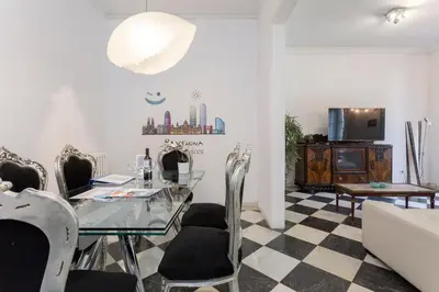 a dining room with a glass table and chairs at 1229 - AWESOME CITY CENTER APARTMENT WITH TERRACE in Barcelona