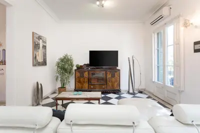 a living room with two white couches and a tv at 1229 - AWESOME CITY CENTER APARTMENT WITH TERRACE in Barcelona