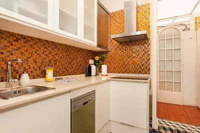 a kitchen with white cabinets and a sink at 1229 - AWESOME CITY CENTER APARTMENT WITH TERRACE in Barcelona