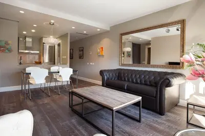 a living room with a couch and a table at Calabria Luxury in Barcelona
