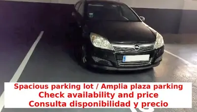 a black car parked in a parking lot at Beach Apartment, next to the sea in Premiá de Mar
