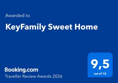 a blue sign that says key family sweet home at KeyFamily Sweet Home in Barcelona