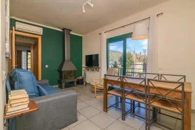 a living room with a couch and a table at Apartaments Rural Montseny in gualba de Dalt