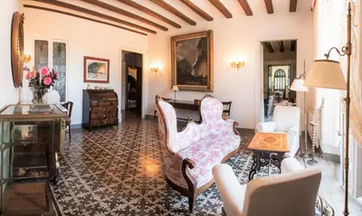 a living room with a couch and a table at B&B Can Casadella in Premia de Dalt