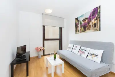 a living room with a couch and a table at Matarolux 14 in Mataró