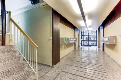 an empty hallway with stairs in a building at Sweett - Ausias Marc in Barcelona