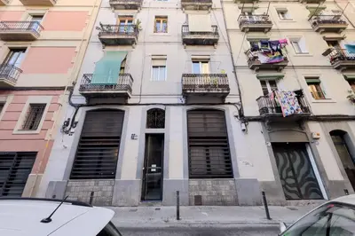 a building with windows and balconies on a city street at Novus Homes Barcelona Poble Sec in Barcelona